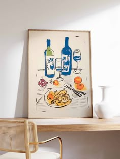 a painting on the wall next to a chair and table with wine bottles, pasta and oranges