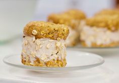 two desserts are sitting on a white plate