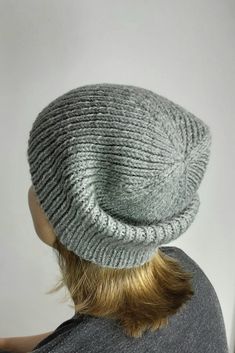 Hand-knitted hat made of 100% wool in gray. This knitted hat is handmade and therefore unique. It is available in one size and is perfect for winter and autumn. The style is a classic beanie that can be worn by both men and women. This wool hat is a must-have accessory for anyone who values craftsmanship and quality. Lovingly handcrafted. Circumference: 54 to 58 cm. Height: 23cm. Material: 100% wool Warm Gray Bonnet One Size Fits Most, Gray Warm Hats In One Size, Gray Warm Hats One Size, Warm Gray Bonnet Cap, Warm Gray Hat One Size, Gray Warm One-size Hats, Gray One-size Beanie Cap, Gray Bonnet Cap, One Size Fits Most, Gray Bonnet Cap One Size Fits Most