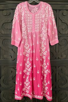 This Pink Ombre Muslin Silk Handcrafted Lucknowi Chikankari A Line Kurta Long Dress is a stunning piece of art. The beautiful pink shade  dress  is perfect for any special occasion. The luxurious fabric and intricate Lucknowi Chikankari embroidery make it a timeless piece that will never go out of style.    Length 48" inches   Long sleeves 18" inches  Round neck  A line   Muslin silk    Chikankari work    Hand embroidered  Margin: no   Dry Clean Chickenkari Suits, Lucknowi Kurta, Goddess Quotes, Pure Cotton Suits, Printed Kurtis, Chikankari Work, Chikankari Embroidery, Bridal Dupatta, Lucknowi Chikankari