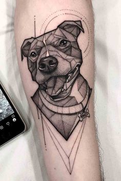 a black and white photo of a dog's face on the arm with geometric shapes