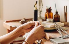 a person is working on some crafting supplies