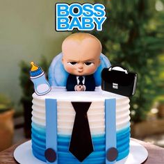 there is a cake that has a baby in it on the top and an image of a man holding a briefcase