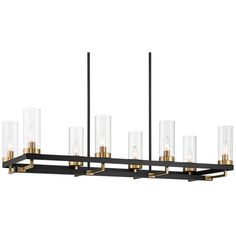 a black and gold chandelier with clear glass shades on the bottom tiers