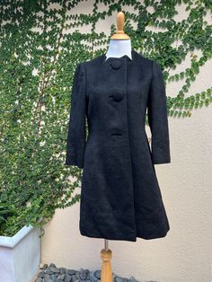 "For sale is a Vintage Tung Sum & co black alpaca long sleeve peacoat with super soft embroidered quilted silk lining and from button down closure. Two pockets on side. Absolutely beautiful piece in perfect condition! Made in Hong Kong, no size tag, see measurements below.  Measurements (flat) Shoulder to shoulder: 14\" approx Overall length: 37\" Armpit to armpit: 18\" Sleeve length: 20\"" Black Designer Wool Coat With Button Closure, Designer Black Long Wool Coat, Designer Black Long Sleeve Wool Coat, Black Wool Coat With Button Cuffs For Formal Occasions, Formal Black Wool Coat With Button Cuffs, Designer Black Outerwear With Hidden Buttons, Designer Black Outerwear With Hidden Button Closure, Designer Evening Outerwear With Button Cuffs, Black Evening Outerwear With Hidden Button Closure