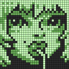 an image of the face of a woman in green and black pixellated pixels on a black background