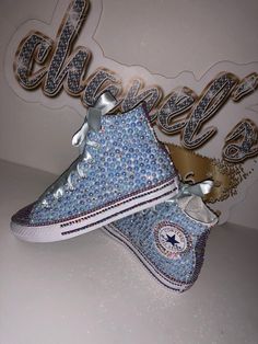 Custom Bling Converse All Star Chuck Taylor Sneakers. All designs handmade and embellished with a variety of high quality crystals. Great for weddings, proms, homecomings, birthdays, special events or just your everyday girly girl. **IF YOU NEED THIS ITEM BEFORE THE PROJECTED SHIPPING TIME YOU MUST CONTACT US BEFORE ORDERING (additional charges may apply) ** Shoe Details: Classic White high top Converse All Star Chuck Taylor Sneaker (Cloth material style) Shoe Size: Toddler kids size 2C to Big k Bedazzled Converse, Quinceanera Shoes, Converse Wedding, Bedazzled Shoes, Bridal Sneakers, White High Top Converse, Bling Converse, Ribbon Shoes, Sneakers High Top