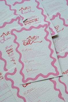 pink and white wedding stationery with red ink