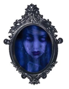 a woman's face is reflected in an ornate frame