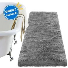 a bath tub with a rug next to it and a sticker that says great choice