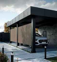 a white car parked in front of a building with wooden slats on the roof