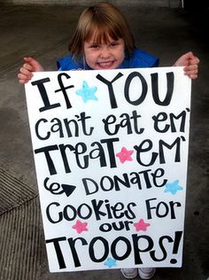 two girls holding up a sign that says if you can't eat my treat, then don't cook for