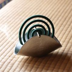 a metal object sitting on top of a wooden table