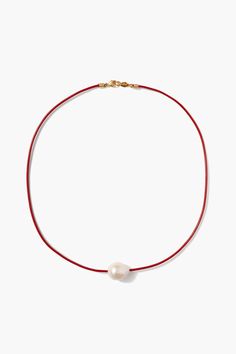 Red leather cord necklace with a single white baroque pearl pendant. Perfect for the beach or as an everyday wear piece.18k gold plated sterling silver.16" in length.Handmade in Vietnam. Jewelry Trends 2024, Baroque Pearl Pendant, Leather Pearl Necklace, Red Beaded Necklaces, Chunky Pearls, Leather Cord Necklace, Black Pearl Necklace, Pearl Necklace Designs, Leather Corded Necklace