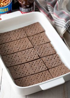 a white baking dish filled with chocolate crackers