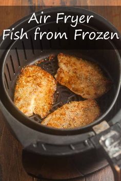 three pieces of chicken cooking in an air fryer