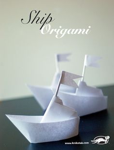 an origami boat is sitting on a table with the words ship organi written above it