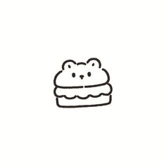 a black and white drawing of a bear on top of a cake with icing