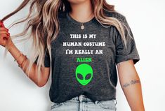 This Is My Human Costume I'm Really An Alien T-shirt, Human Costume Alien T-shirt, Halloween Alien Costume T-shirt. The perfect shirt as a costume for Halloween! T-shirt is Bella + Canvas 3001 100% Airlume combed and ringspun cotton (fiber content may vary for different colors). Nice and soft, and made in the US, and runs true to size (see our size chart)! Diy Alien Costume Women, Halloween Alien Costume, Diy Alien Costume, Alien Costume Women, Diy Alien, Alien Costume, Costume For Halloween, Costume Women, Costume Shirts