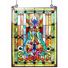 a stained glass window hanging on a chain