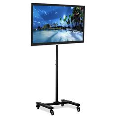 a flat screen tv sitting on top of a black stand