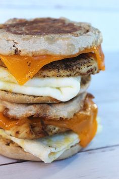 an egg white grilled cheese sandwich is stacked on top of each other with the text copycat chick fila egg white grill