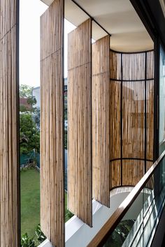 the inside of a building with wooden slats