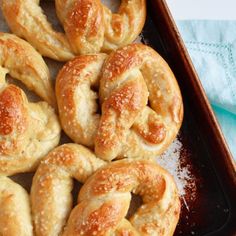 there are many pretzels on the tray ready to be eaten