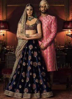 This Deep Blue Color Wedding lehenga is in silk velvet embroidered with thread and zardozi work. Dupatta is in gold color net fabric with embroidered edges and sequins butties inside. Blouse is also fully embroidered. Anarkali Velvet Lehenga For Wedding, Anarkali Wedding Velvet Lehenga, Wedding Velvet Fitted Lehenga, Traditional Velvet Sharara For Receptions, Anarkali Velvet Sharara For Wedding, Velvet Traditional Wear With Pallu For Wedding, Velvet Anarkali Sharara For Wedding, Wedding Velvet Traditional Wear With Pallu, Velvet Traditional Drape Wear For Weddings