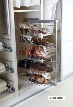 a closet with several pairs of shoes on it