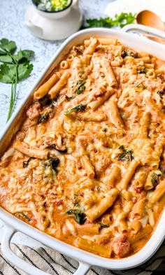 a casserole dish filled with pasta and meat