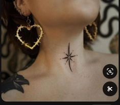 a woman with a cross and heart tattoo on her neck