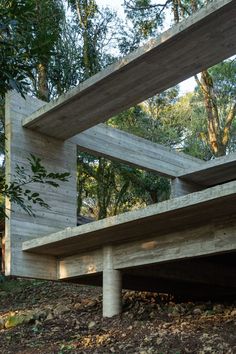 the wooden structure is made from concrete and has multiple sections that are connected to each other