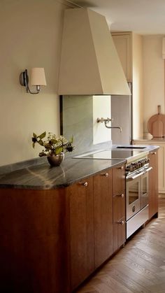 a kitchen with an oven, stove and counter top in it's center island