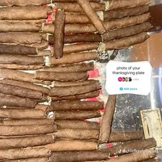 a pile of cigars sitting on top of a counter next to a sign that says, photos of your thanksgiving plate