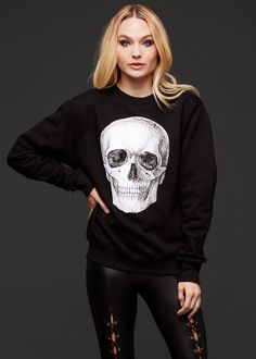 Keep cozy and comfy while you add more skulls to your sweater collection! This rad skull sweatshirt is an essential layering piece for the season! The sweater features a white skull design in the front, a boucle french terry fabric, long raglan sleeves, a boat neck neckline and a generous cuff on sleeve and waist hem. The relaxed fit makes it a stylish cold weather layer. Style with faux leather pants, skirts and skinny jeans for the perfect every day look or with sweatpants for comfy weekends a Goth Sweater, Black Lace Choker Necklace, Sequin Flare Pants, Goth Pants, Skeleton Sweatshirt, Black Lace Choker, Skull Sweatshirt, Skull Sweater, Fur Leather Jacket