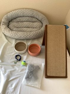 the cat bed is ready to be placed on top of the bed with other items