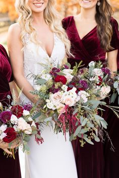 three bridesmaids holding bouquets in their hands