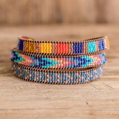 Inspired by the colorful buildings, cobblestone streets, and the yellow Santa Catalina arch framing Aqua Volcano, Álvaro Ratzan handcrafts this vibrant beaded wrap bracelet. Stringing beads on a tiny loom, the leather cord bracelet adjusts to 2 lengths with a pewter button clasp. Stringing Beads, Bead Woven Bracelet, Colorful Buildings, Leather Cord Bracelets, Cobblestone Streets, Bracelets Handmade Diy, Santa Catalina, Bead Loom Bracelets, Woven Bracelet