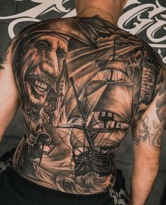 a man with a pirate tattoo on his back