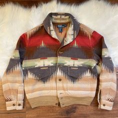 Extremely Rare, Limited Edition Wool Blanket Button-Up Jacket, Wool/Cotton Blend (38%, 62% Respectively) With A Spectacular Western Aztec Pattern Accent By Polo Ralph Lauren. We Have Taken An Over Abundance Of Pictures To Ensure The Buyer Knows Exactly What They’re Getting! Note There Are No Stains, Tears, Rips, Or Defects Anywhere. Measurements Taken In Inches: Pit To Pit: 23 1/2” Sleeve: 24 1/2” Top Of Shoulder To Bottom Seam: 23 1/2” No Odors Detected Whatsoever. Comes From Pet-Free, Smoke-Free Home. This Item Will Be Sent Signature Required + Complimentary Insurance To Protect Us Both! -Frothymart Blanket Jacket, Western Aztec, Cotton Blanket, Aztec Pattern, Cotton Blankets, Wool Blanket, Polo Ralph, Polo Ralph Lauren, Button Up