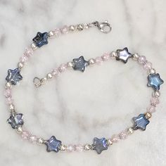 Handmade Beaded Ankle Bracelet Holographic Blue Stars, Light Pink Crystals, Silver Plated Beads 9.75" Length Lobster Clasp Closure New Midnights Bracelets, Star Bead Bracelet, Bracelet Business, Silver Bracelet Designs, Stars Light, Ankle Bracelets Diy, Holographic Blue, Beaded Ankle Bracelets, Beaded Things