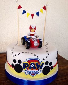 a birthday cake with paw patrol on top