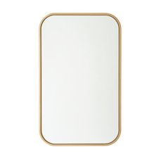 a white and gold mirror on a white wall with a wooden frame in the shape of a rectangle