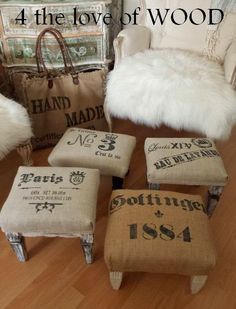 four stools and one footstool are sitting on the floor in front of a chair