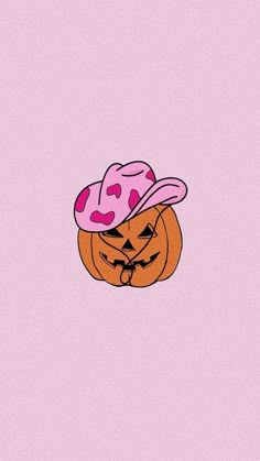 an orange pumpkin with a pink hat on it's head