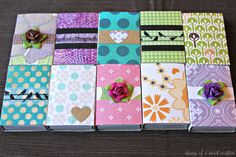 many different colored papers with flowers and hearts on them, all lined up next to each other