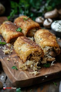 some food is laying out on a cutting board with mushrooms and parmesan cheese