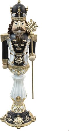 a figurine with a crown on it's head and a cane in his hand