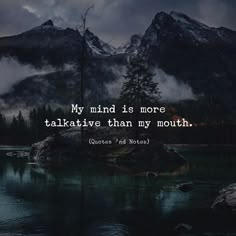 a lake with mountains in the background and a quote on it that says, my mind is more talkative than my mouth